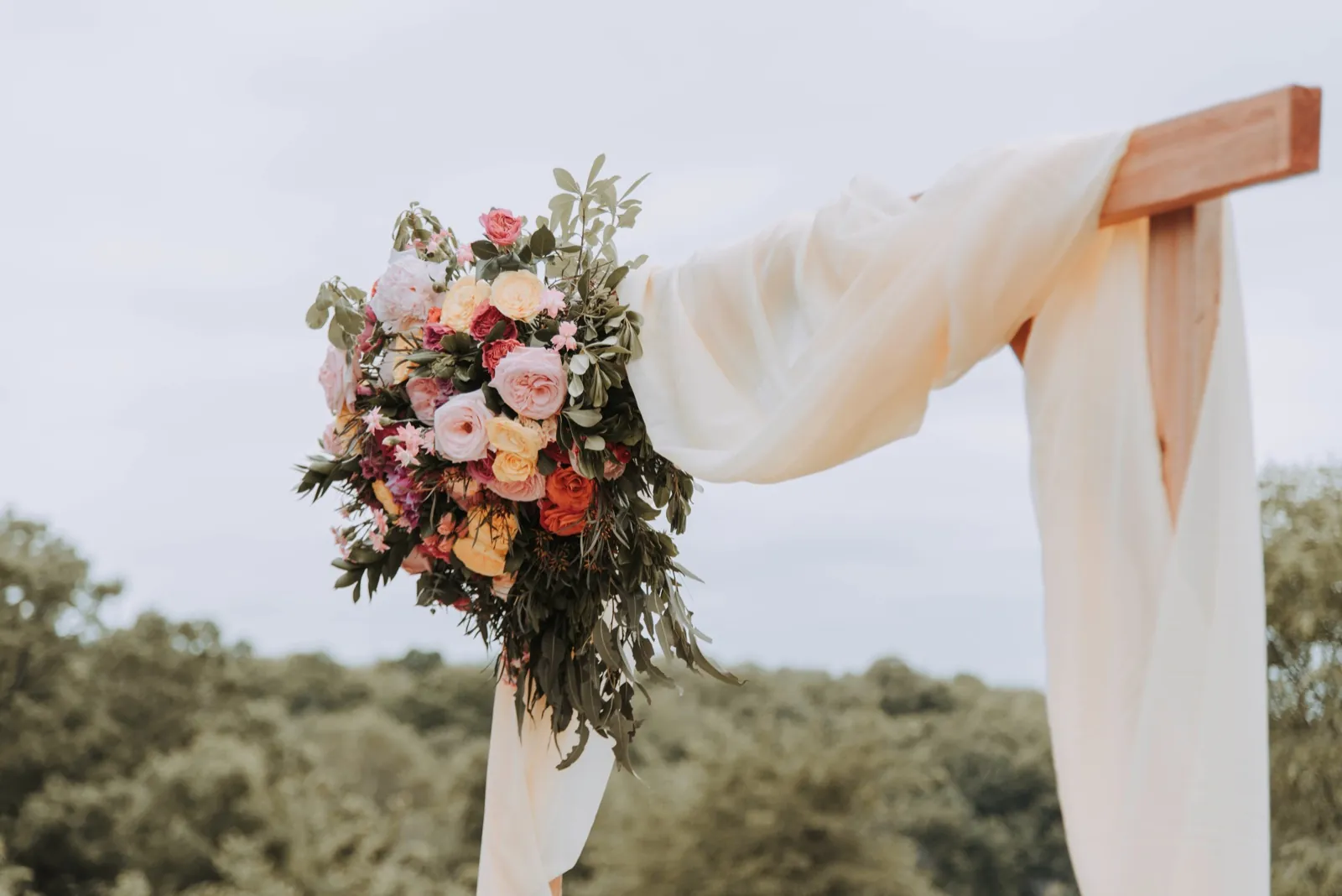 A floral ceremony arch overlooking the Perth Hills