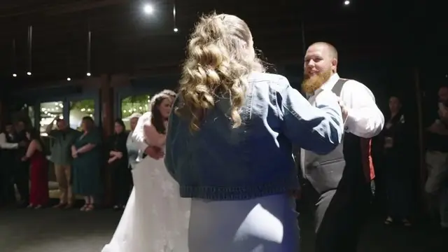 Wedding film still: first dance under the reception lights
