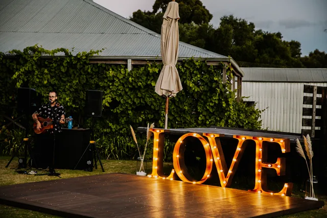 Illuminated LOVE sign and live music at the Riverbank Estate reception