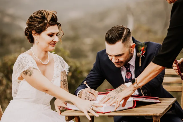 Bride and groom signing the marriage register