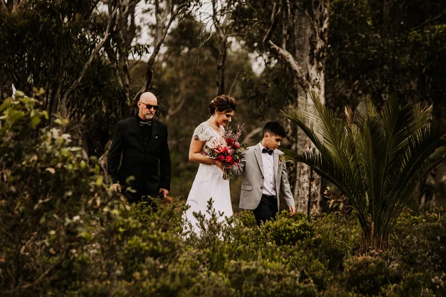 Bride walking through the bush to her ceremony