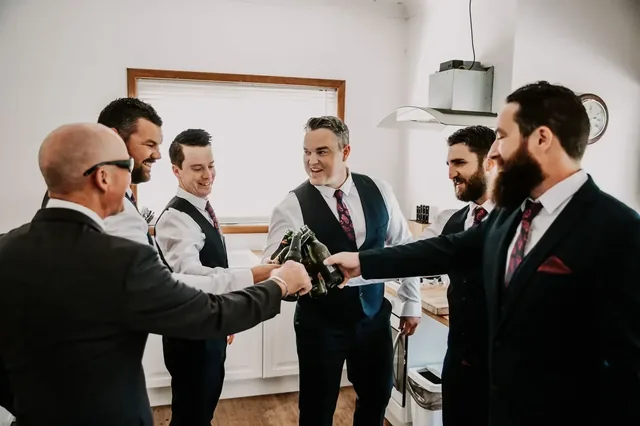 Groom and groomsmen getting ready before the wedding