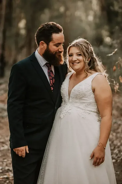 Bride and groom close together in the Mundaring bush