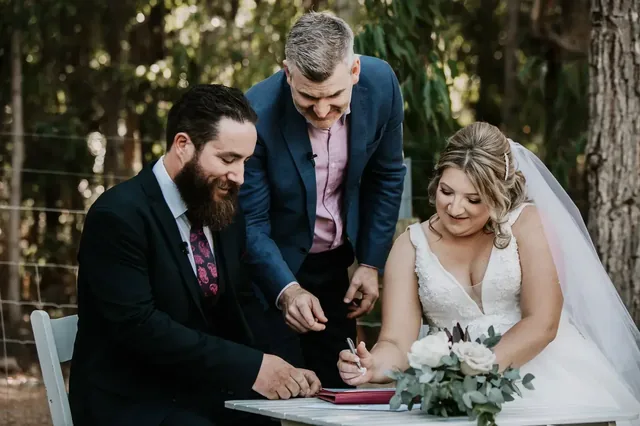 Bride and groom signing the marriage register