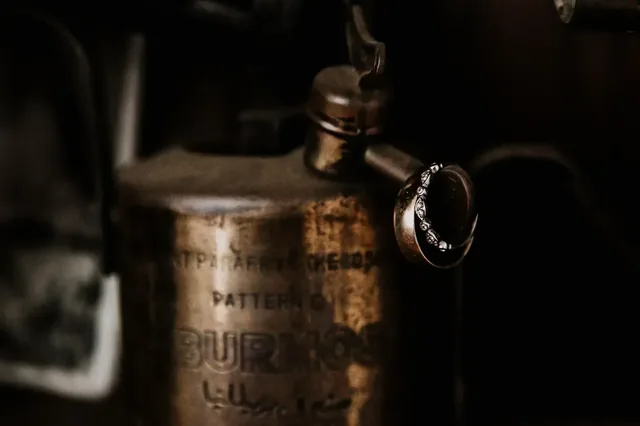 The wedding rings resting on a vintage burner
