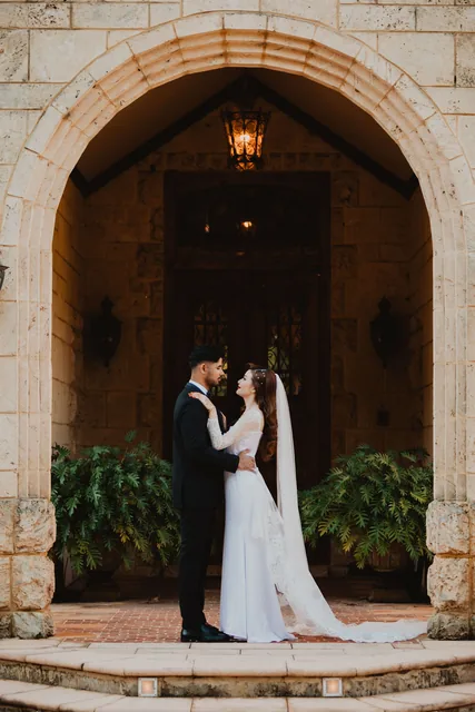 The couple together in the Chateau’s arched stone doorway