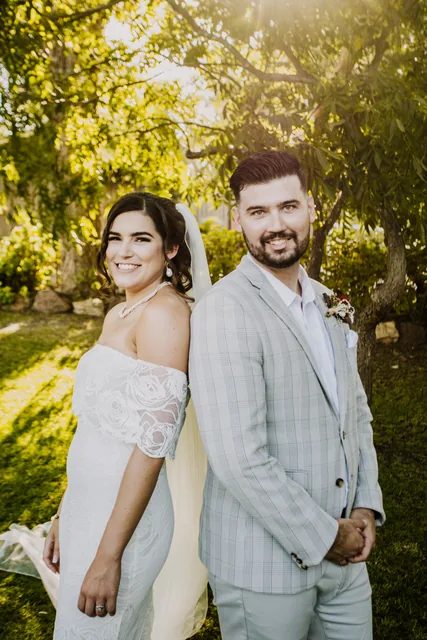 Bride and groom together in the gardens at The Olive Estate