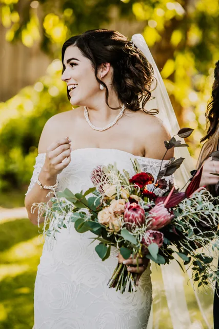 Bride holding a native bouquet of proteas and eucalyptus