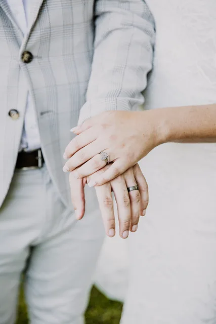 The couple's hands and wedding rings after the ceremony